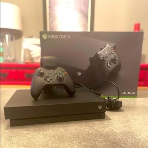 XBox One X with HDMI cable, one controller, and dual charger. Smoke free home.